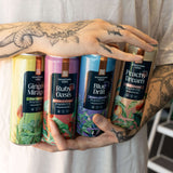 Hands holding Hometown Hero THC lemonade cans